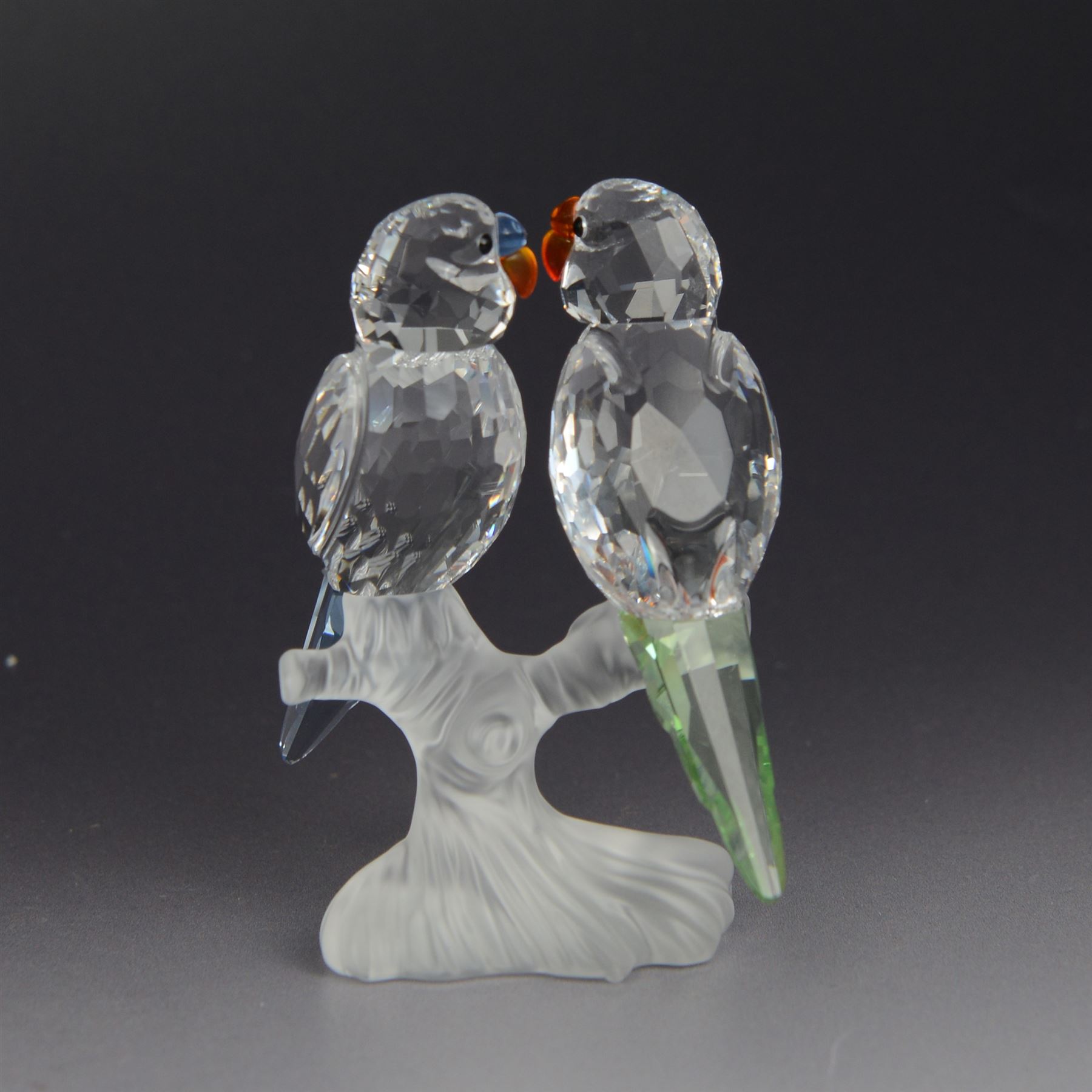 Three Swarovski figures, comprising Giraffe, Cobra and Budgies, all with original boxes  