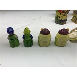 Collection of Japanese Maruhon ware novelty preserve pots, to include examples modelled as a windmill and cottages, together with other 1920s and 30s Art Deco style preserve pots, etc