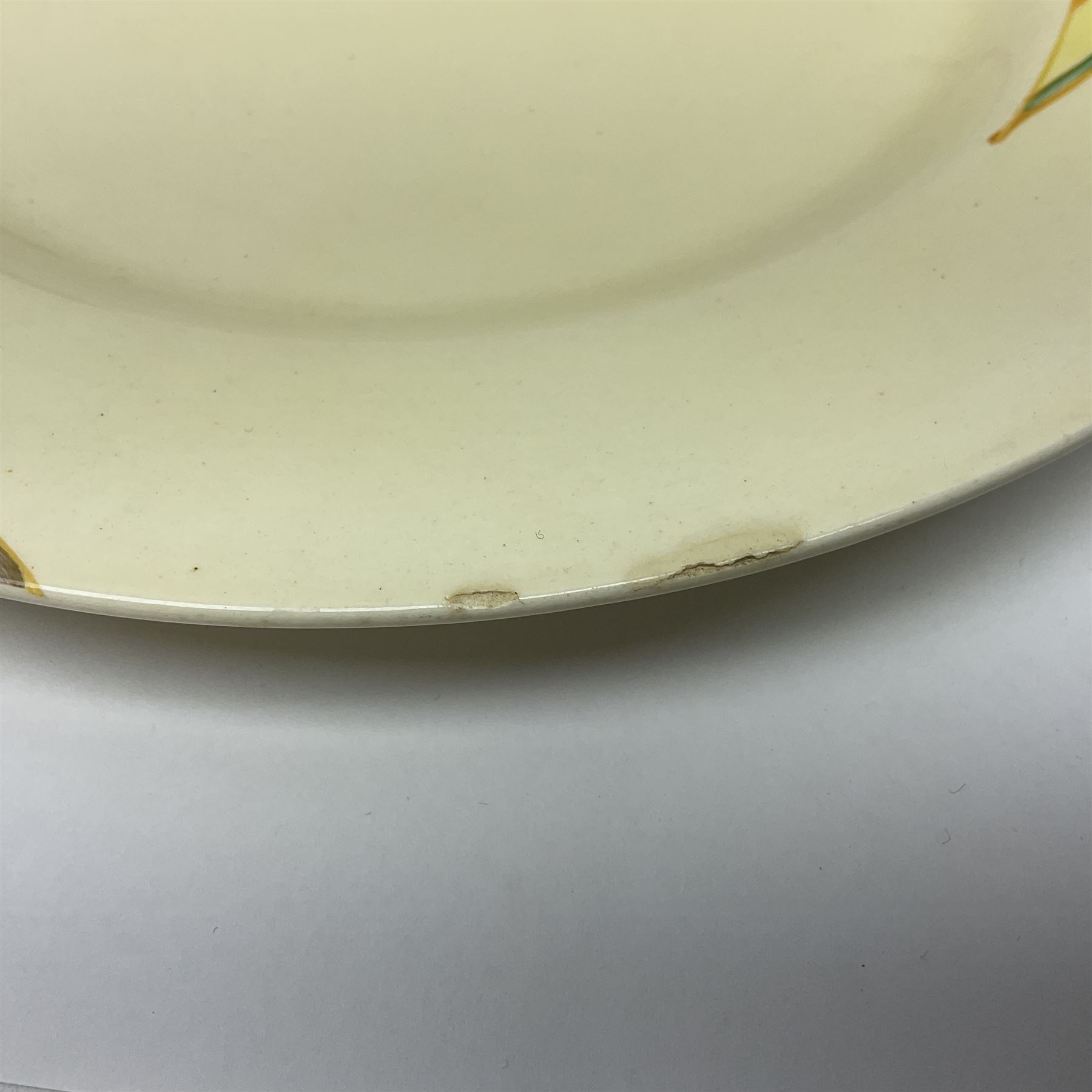 Clarice Cliff for Newport Pottery plate in Yellow Rose pattern, with printed mark beneath, D23cm