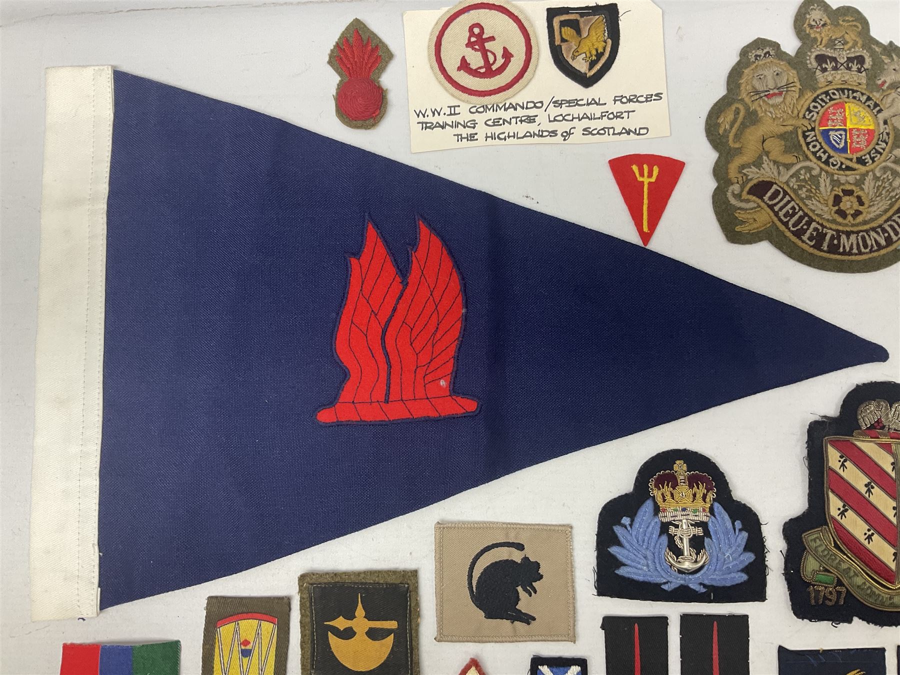 Royal Arms cloth arm adge as worn by Regimental Serjeant-Majors in Foot Guards; naval cap badge; WW2 Commando/Special Forces cloth badges; Home Guard and LDV shoulder titles; and other cloth badges including armoured division, 45th and 77th division, 52nd Lowland Mountain division etc; and 24th Infantry Brigade airmobile pennant