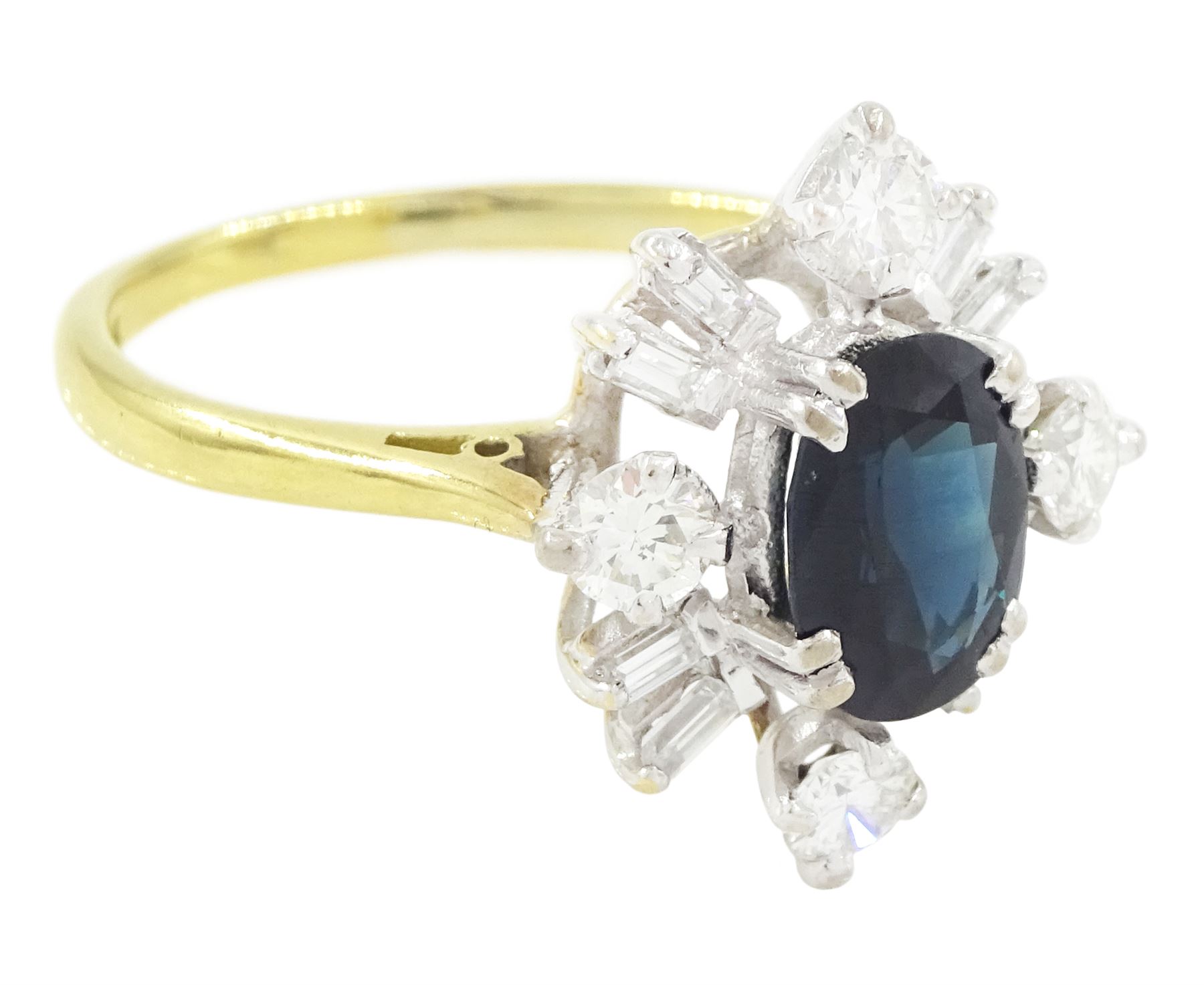 18ct gold sapphire and diamond cluster ring, single oval cut sapphire of approx 1.65 carat, surrounded by four round brilliant cut diamonds and eight baguette cut diamonds, London 1975, total diamond weight approx 0.60 carat
