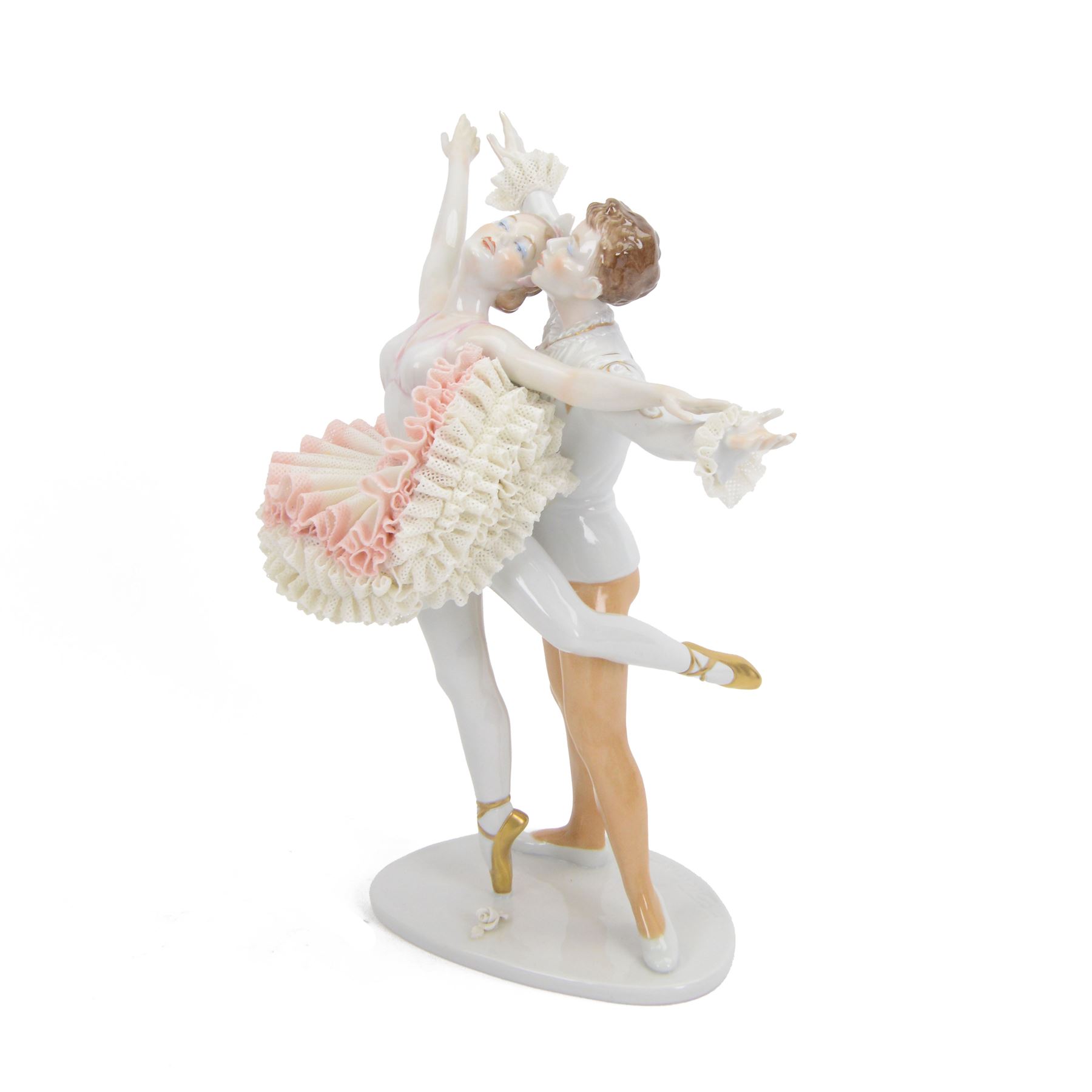 Unterweissbach lace figure, designed by K. Steiner, modelled as two ballerinas, the female figure with lace tutu, the male figure with lace cuffs, upon a shaped base with incised signature, with printed mark beneath, H26cm
