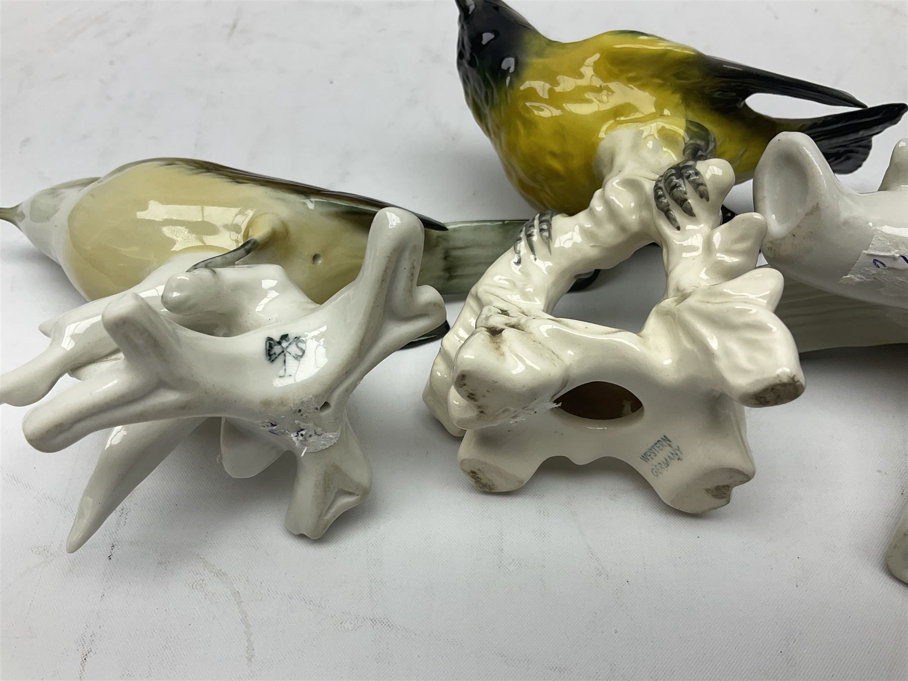 Eight Karl Ens bird figures, together with Mack blue tit and one other