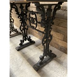 Four cast iron pub or bar tables with rectangular tops