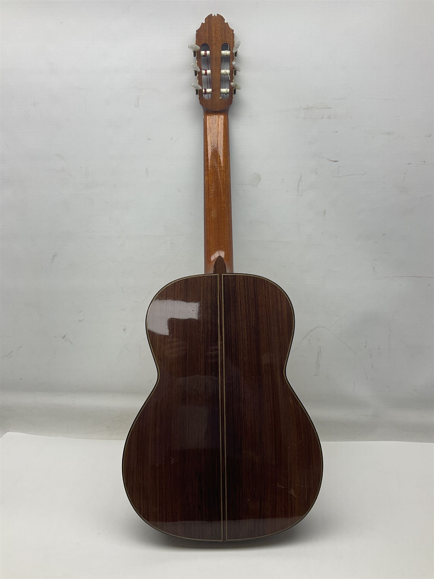 British hand made classical acoustic guitar by Huw Morgan with Indian rosewood back and sides and spruce top; bears label dated May 1998; L100cm; in Tribal Planet lightweight carrying case