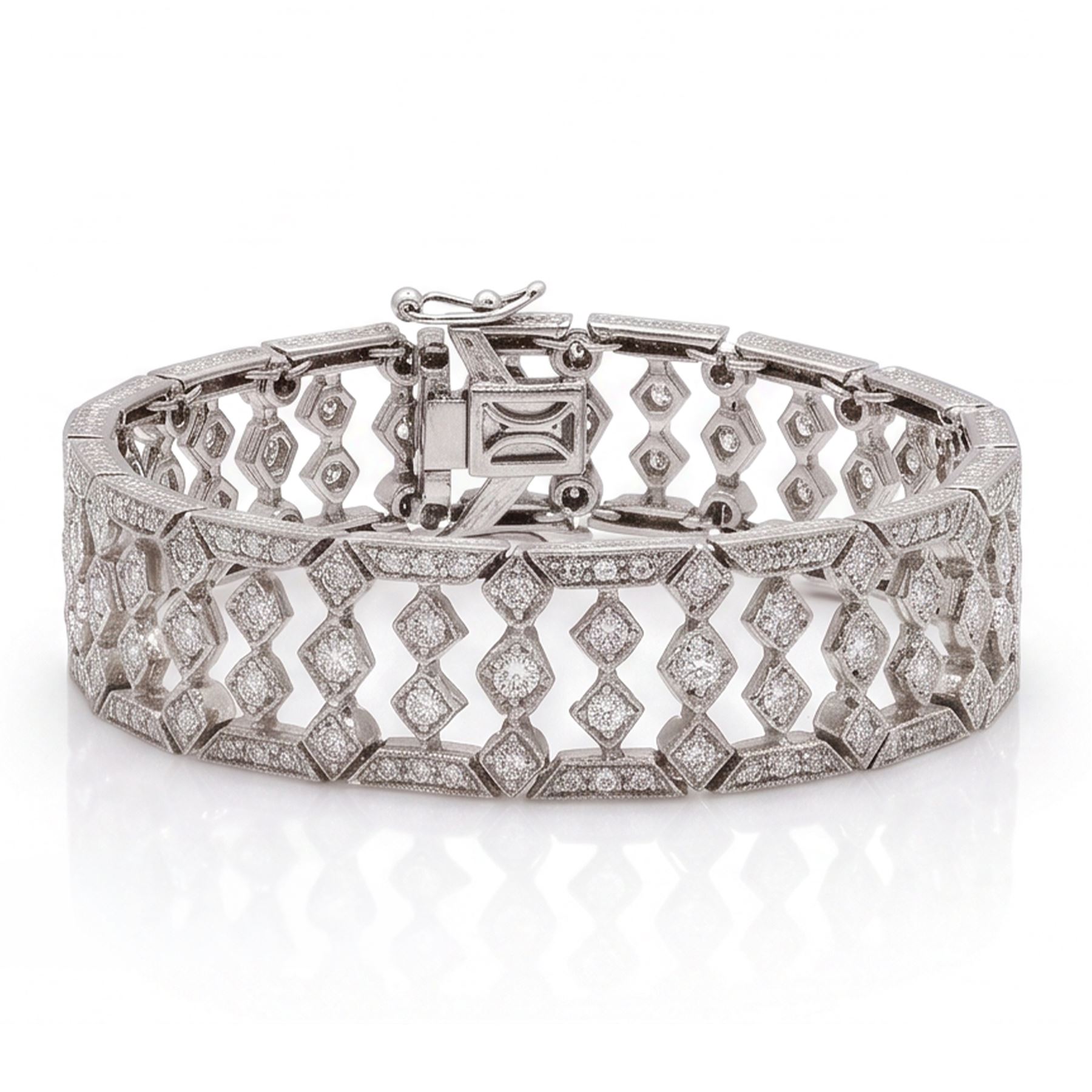 18ct white gold diamond bracelet, articulated and pierced design milgrain links set with round brilliant cut diamonds, the sides with engraved foliate decoration, stamped 750, total diamond weight approx 4.15 carat
