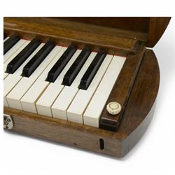 20th century-silent practice keyboard with a 5 octave compass C-C  (61 notes) with adjustable key weight adjustment, in an oak case. Possibly intended as an organists practise keyboard. 