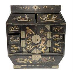 Late 19th/early 20th century Japanese table top cabinet, decorated ornately in gilt with birds and blossoming branches, the two hinged doors to the centre opening to reveal compartmented letter rack interior flanked by various long and short drawers (a/f), H32cm