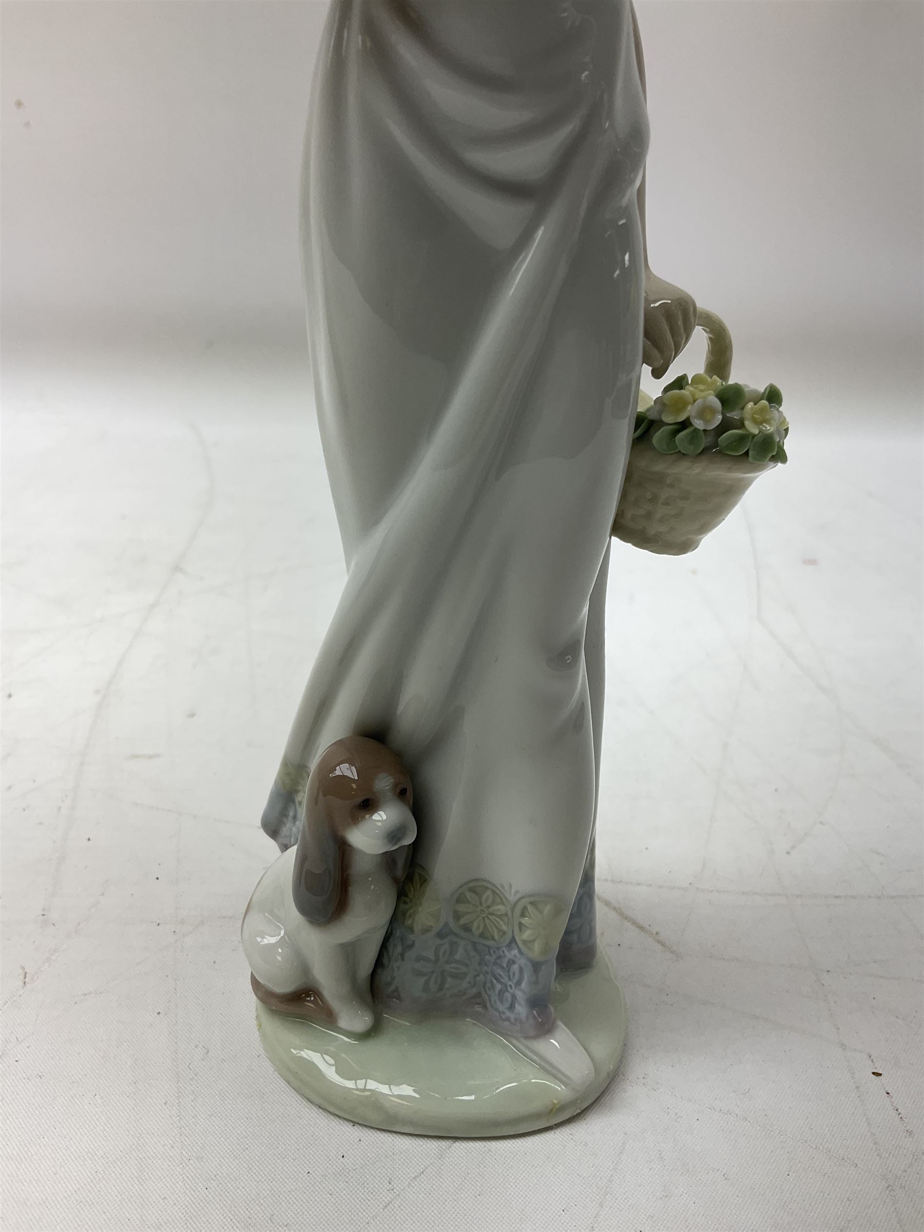 Two Lladro figures, comprising Garden Classic, no 7617 and Garden Song, no 7618, with original boxes and artists signature beneath, largest example H23cm