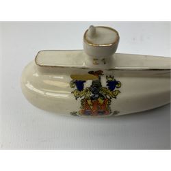 Three pieces of crested ware, comprising grenade detailed 'The Mills Hand Grenade' with Filey Crest, marked beneath Grafton China, a cannon with crest banner detailed 'Sterlini Oppidvm', marked beneath W H Goss, and a submarine with Tunbridge Wells crest, marked beneath Arcadian China 