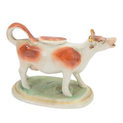 Collection of 19th century and later cow creamers, including three black glaze examples, two mottled brown examples etc  