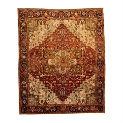 Northwestern Persian Heriz carpet, crimson ground and soft green field, with bold terracot...
