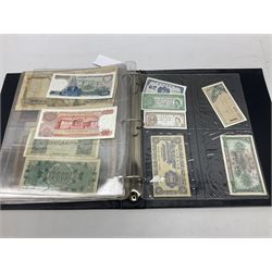 World banknotes, including Queen Elizabeth II The States of Jersey one pound 'DB202703', five pounds 'BB527762' and ten pounds 'AB651481', reserve bank of New Zealand two dollars '1L3 741894', King George V Straits Settlements one dollar 1st January 1935 'F/83 28924', various Bank of England notes etc, housed in two ring binder albums