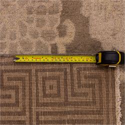 Indian Khetar hand knotted carpet, the brown ground decorated with an all over scrolling foliate and palmette design, enclosed within a conforming floral border with guard stripes