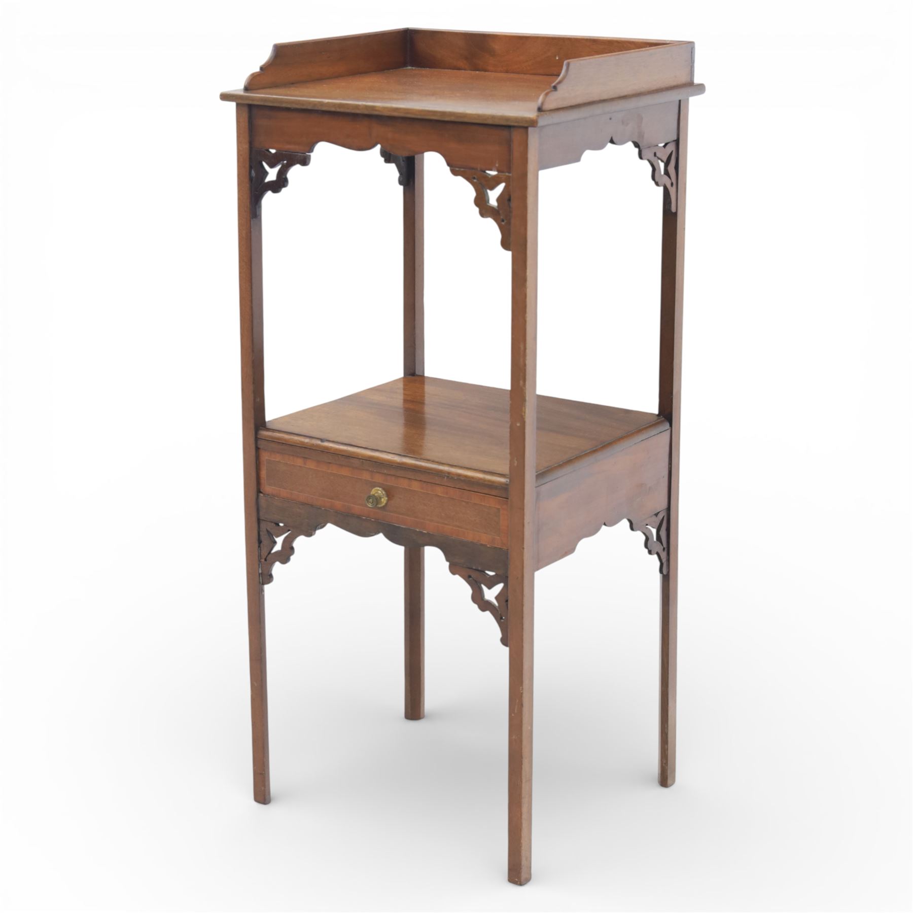George III mahogany two tier night stand, rectangular tray top with three quarter gallery and shaped cut corners, pierced fret brackets to the apron, fitted with a single drawer to the lower tier, raised on slender square section legs