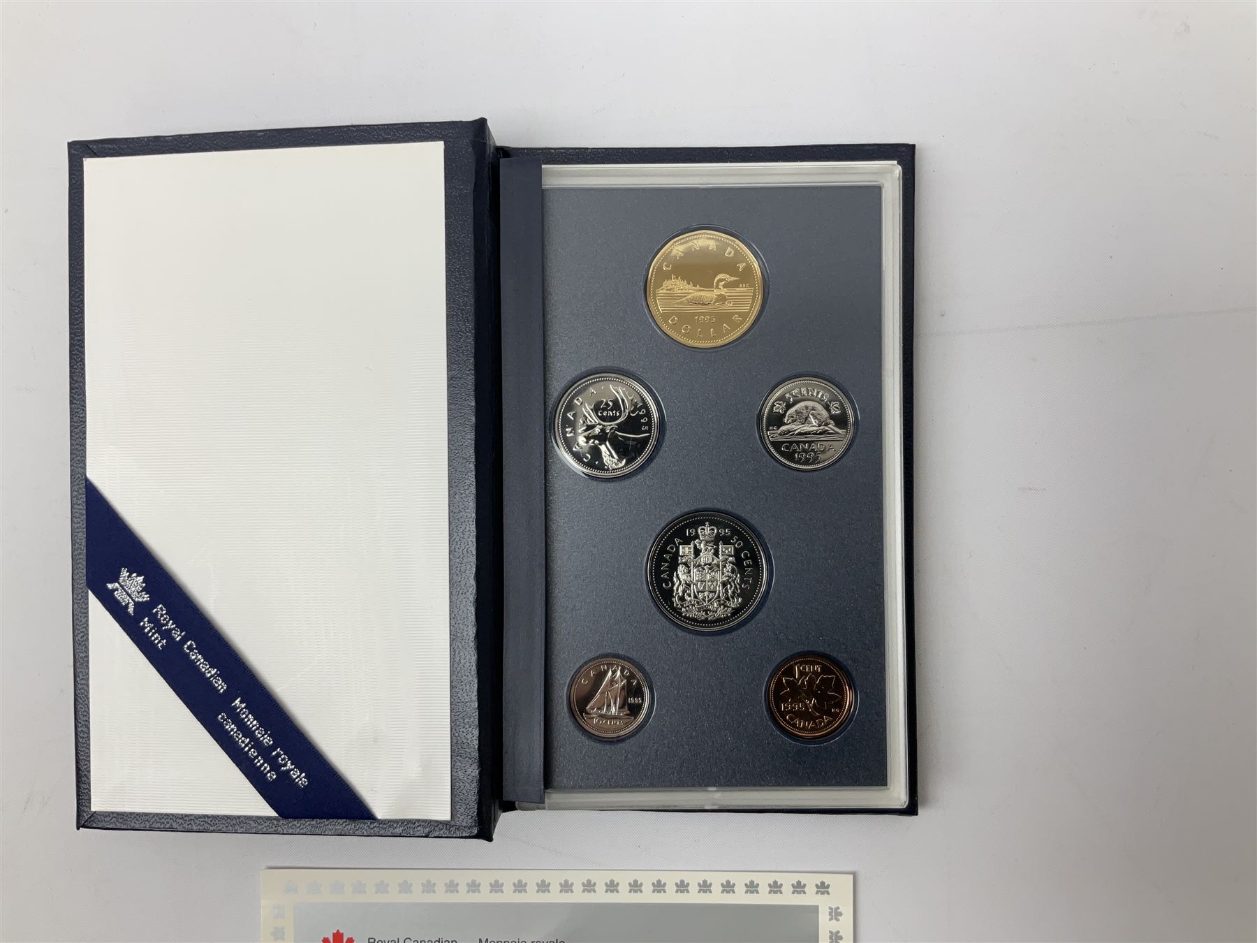 Canadian coinage including Queen Elizabeth II 1964 and four 1966 dollars, 1975 Olympic four coin set comprising two five dollar and two ten dollar coins, 1995 specimen coin set in blue folder, 1995 uncirculated coin set etc 