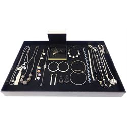 Collection of jewellery including a Links of London silver shoe charm, two silver bangles, silver stone set bracelet, silver and enamel charm bracelet and assorted items of costume jewellery, tray not included
