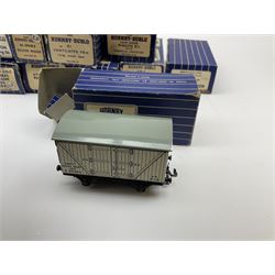 Hornby Dublo - twenty wagons including Cattle Truck; Low-Sided Wagons; Cable Drum Wagon; Tank Wagon for Shell Lubricating Oil; Mineral Wagons; 20-Ton Bulk Grain Wagons; Goods Brake Vans; Sand Wagons; Ventilated Van; Double Bolster Wagon etc; all in blue striped boxes (20)