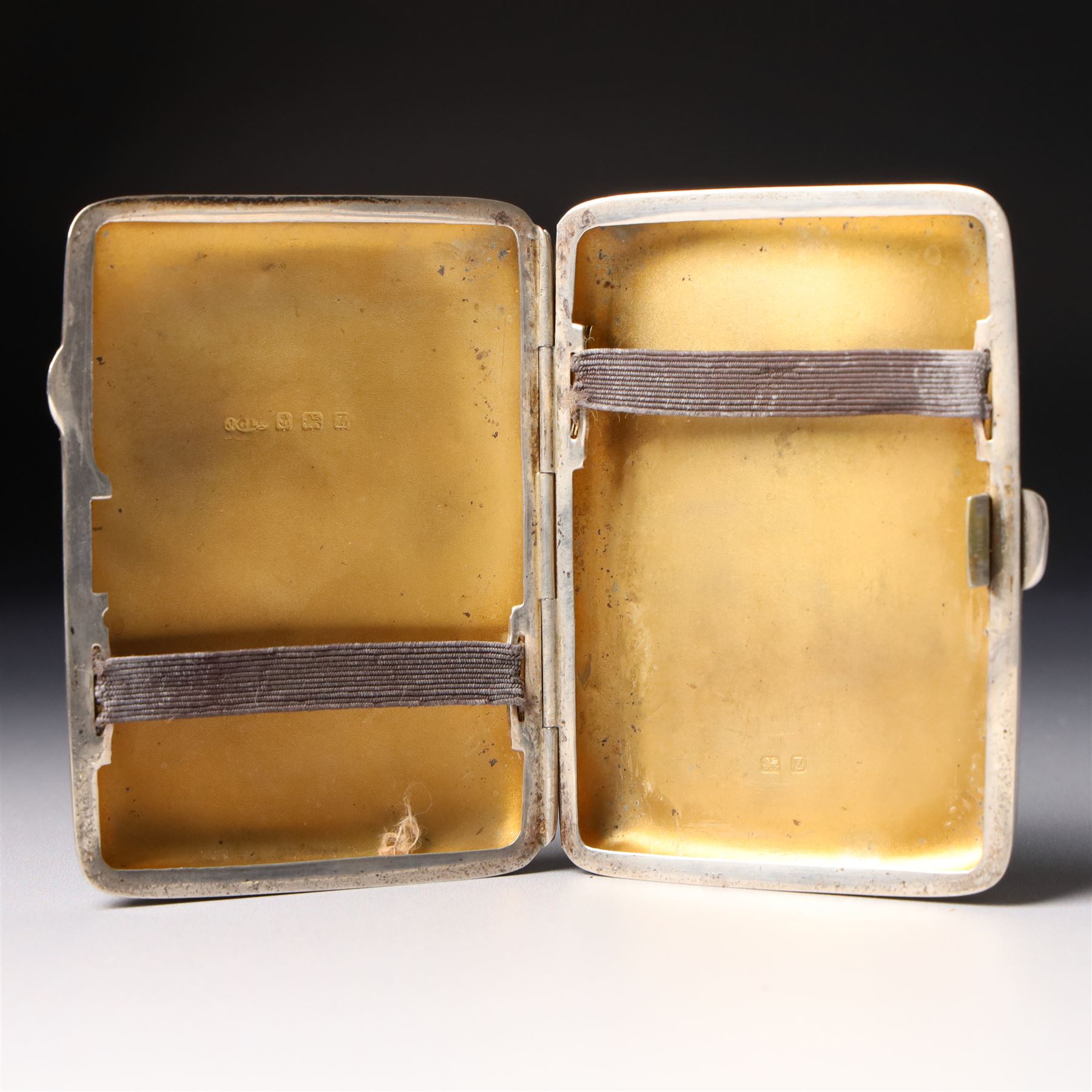 Engine turned silver cigarette case Birmingham 1935 10.5cm x 8cm and two smaller cigarette cases