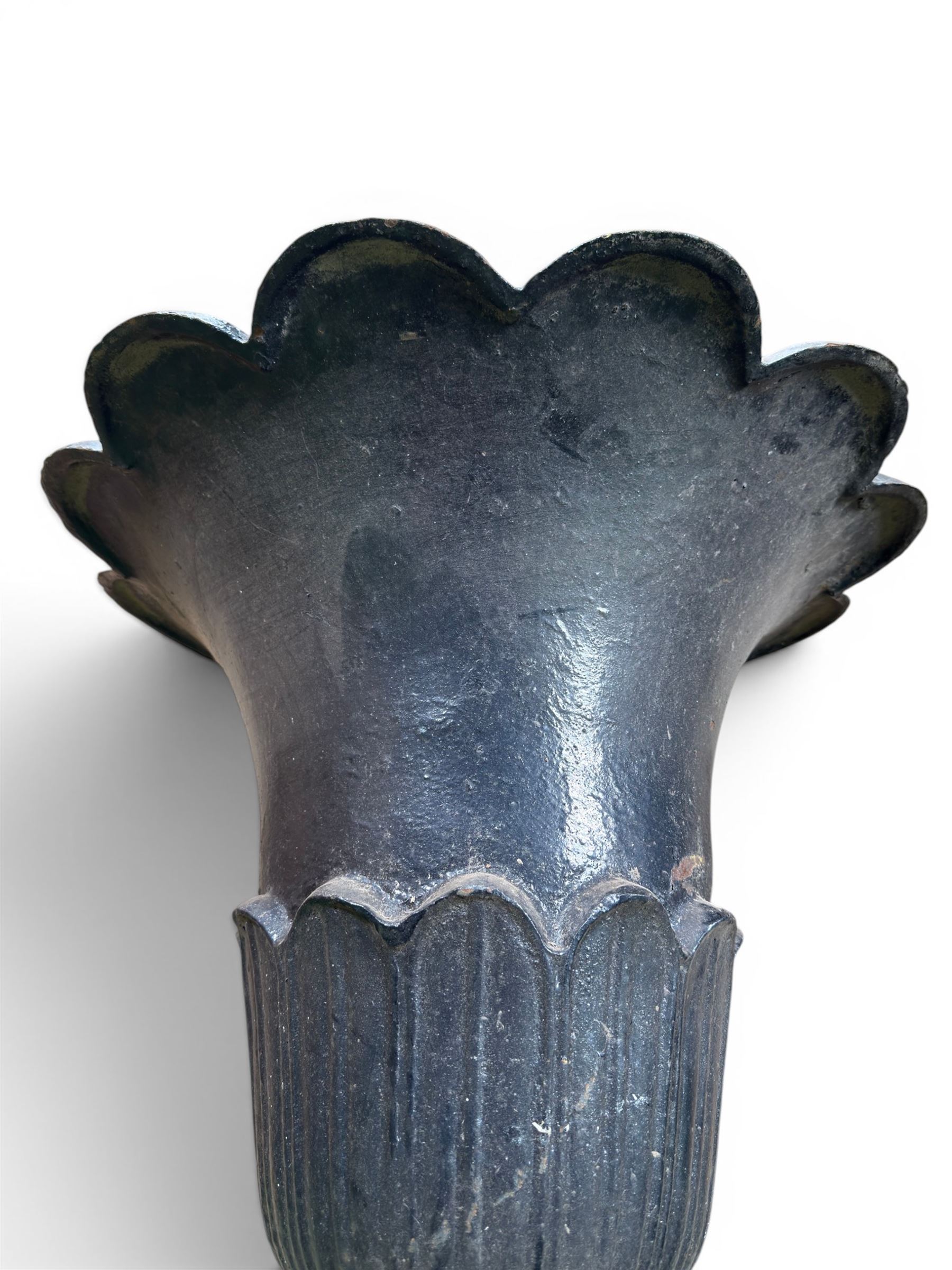 Pair of Victorian large scale cast iron garden urns, flared petal shaped rim with tapering waist, gadrooned base on square plinth, finished in black paint