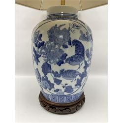 Chinese blue and white table lamp of baluster form, decorated with birds and floral displays, on hardwood base with shade, H78cm