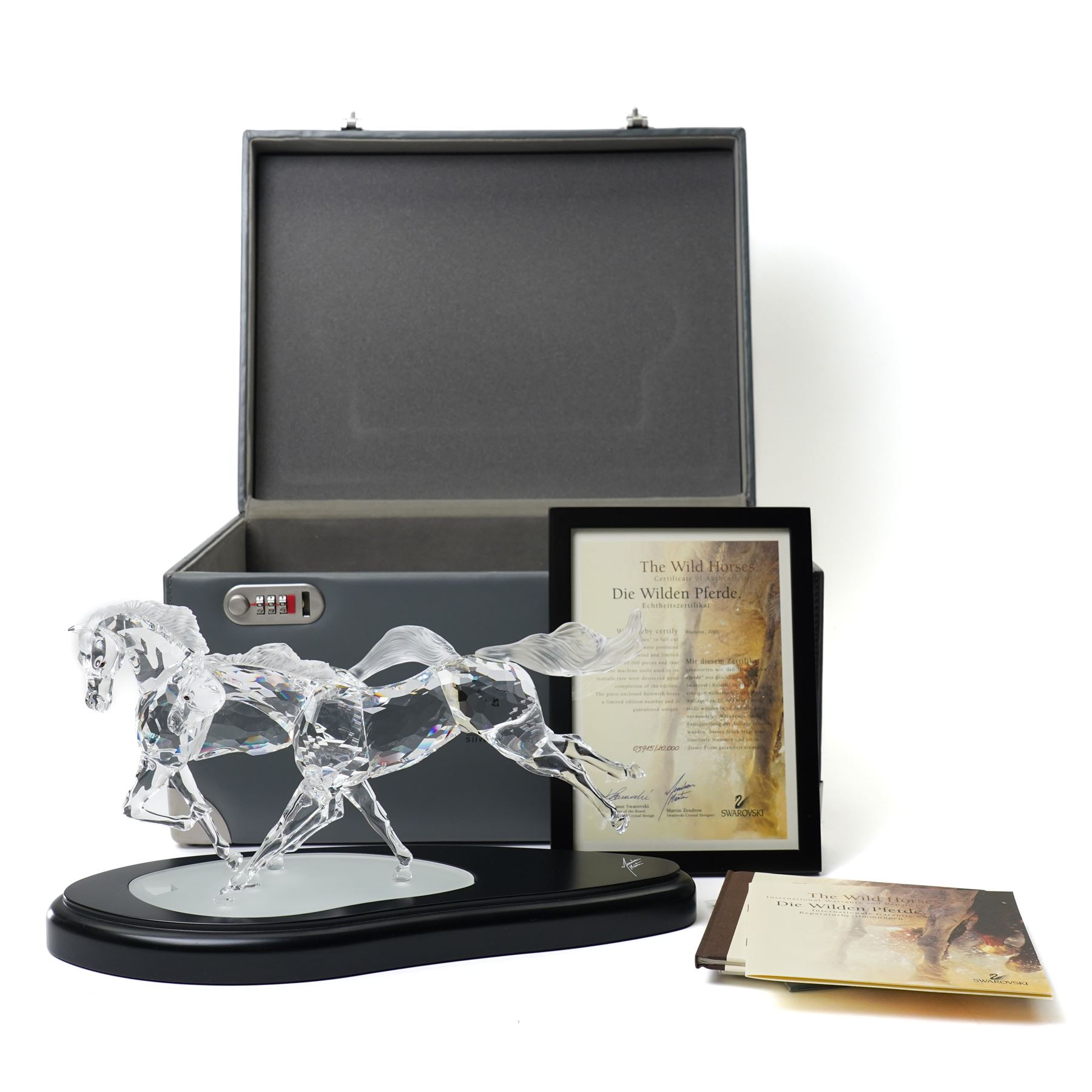 Swarovski, Wild Horses, modelled as two galloping horses upon a wooden plinth, limited edition 3915/10000, with certificate and case, H20cm