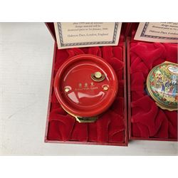 Eight Christmas themed Halcyon Days enamel boxes, and a Halcyon Days enamel bonbonniere modelled as a snowman, each in fitted box 