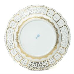 19th century Meissen cabinet plate, the reticulated border modelled with trellis panels and forget-me-nots,  the cobalt blue well with gilt bordered central reserve painted with a scene of a hunting party resting after Philips Wouwerman (Dutch 1619-1668), underglaze blue crossed swords and indistinct impressed numbers verso, D26cm