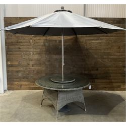 LeisureGrow circular rattan garden table, with lazy Susan, five armchairs with cushions, parasol and weighted base, with glass tops