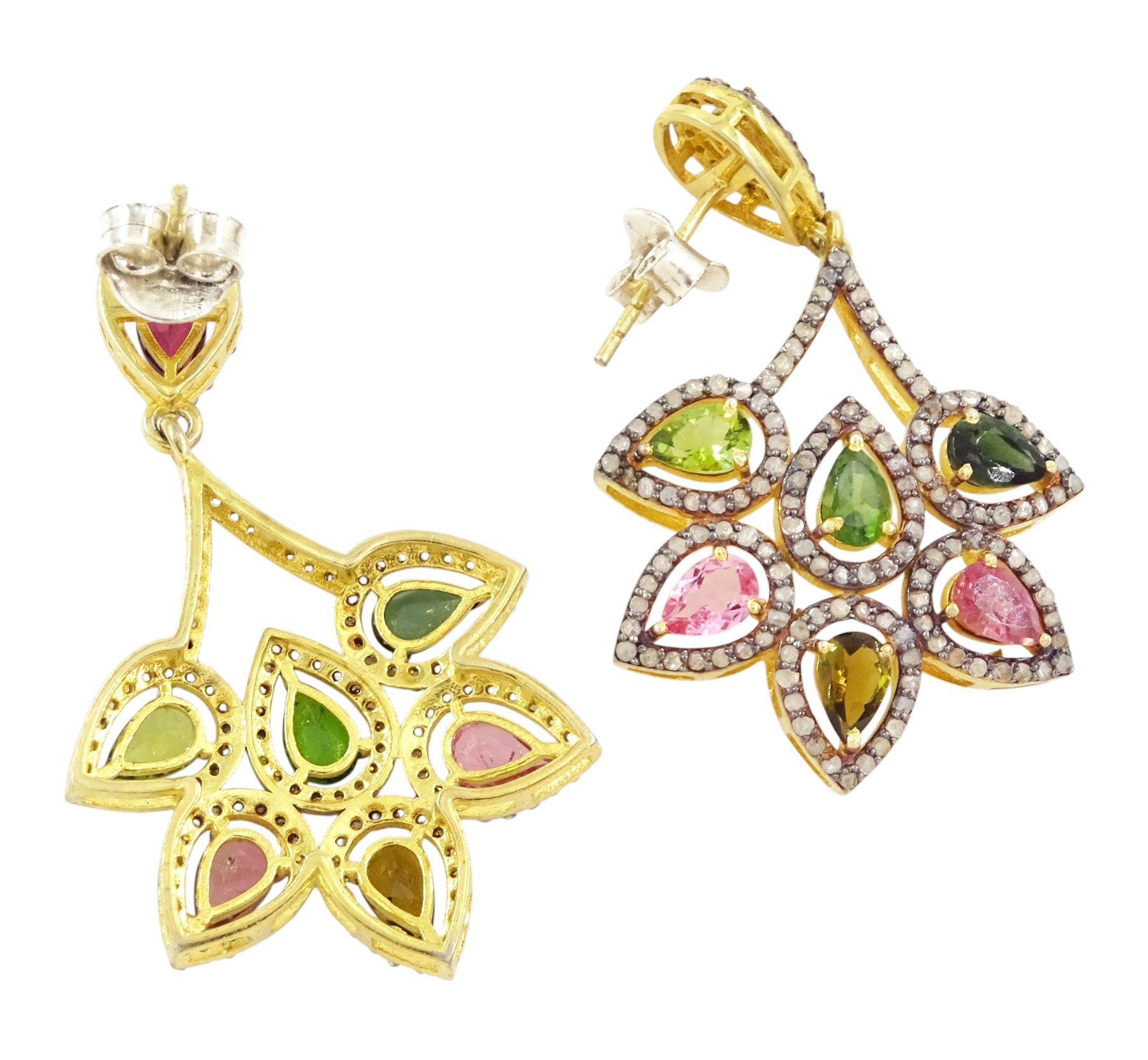 Pair of silver and silver-gilt tourmaline and diamond earrings, each stud set with seven pear cut tourmalines including green and pink, each surrounded by rose cut diamonds, total tourmaline weight approx 4.50 carat, total diamond weight approx 1.80 carat