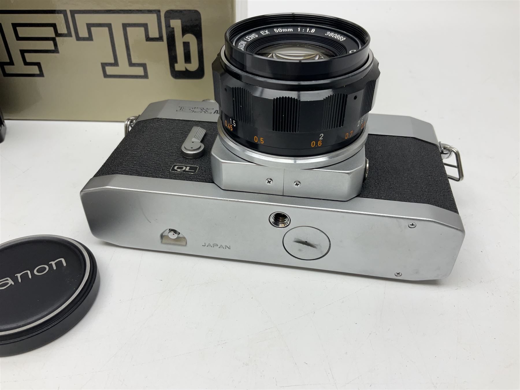 Canon FTb camera body, serial no. 715838, with 'Canon FD 50mm 1:1.8' lens, serial no. 207888, in original box, together with Canon FTb camera body, serial no. 557817, with 'Canon FD 35mm 1:3.5 S.C' lens, serial no. 126210 and Canon EX Auto camera body, serial no. 296244 with 'Canon EX 50mm 1:1.8' lens, serial no. 380869  