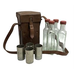 WWII leather cased set of four glass flasks and cylindrical cups, the case embossed 'CM3216 B.H.G. 1942'