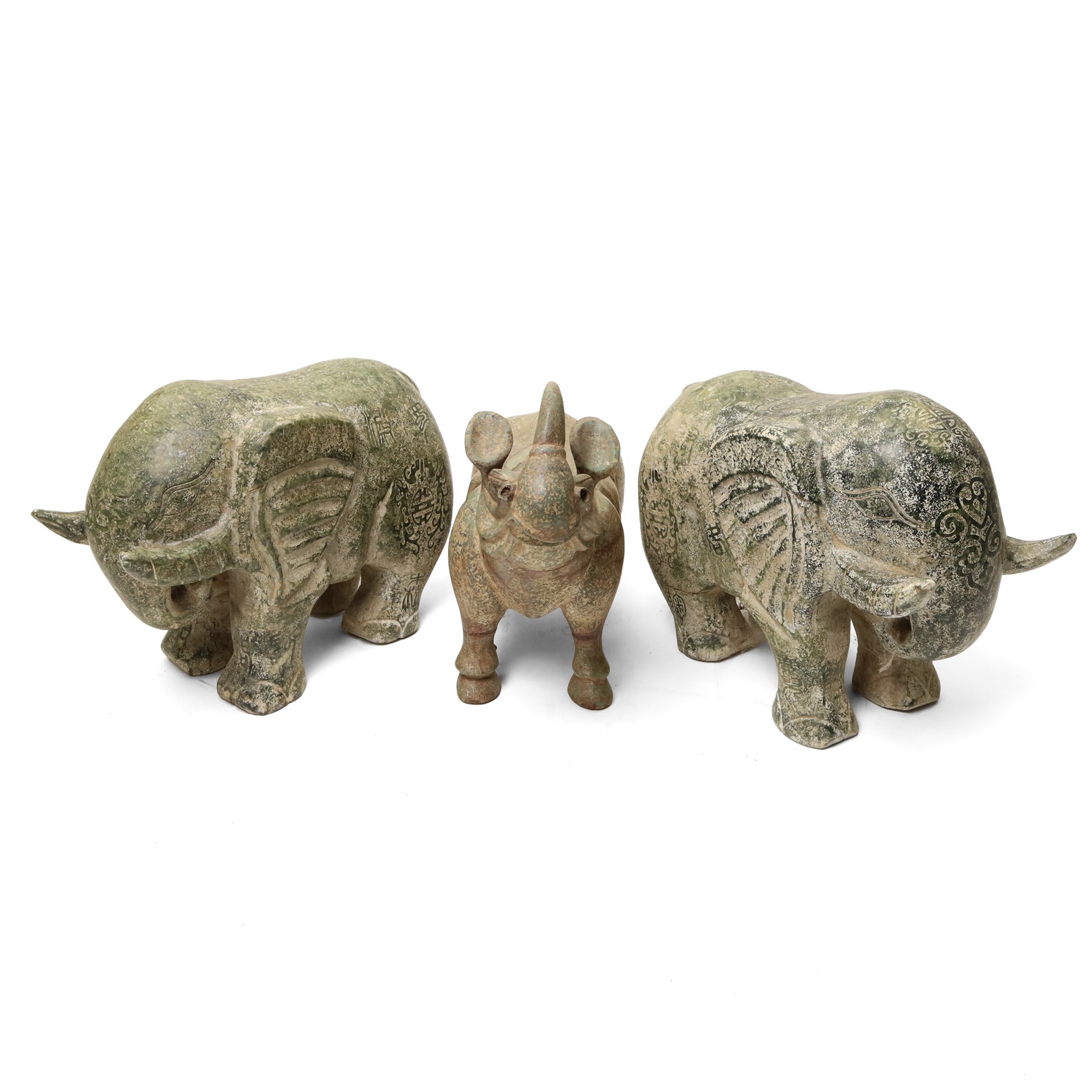 Carved stone Rhino, W44cm and a pair of two green stone Elephants, W38cm (3)