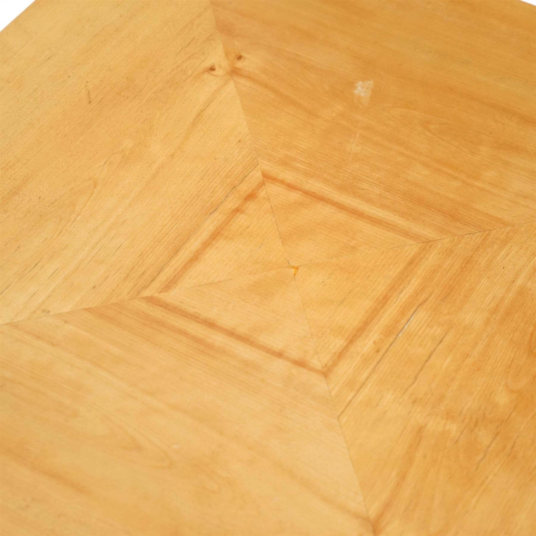 Mid 20th century German Art Deco occasional table, the octagonal top with radiating veneer panels, on tapering angular supports