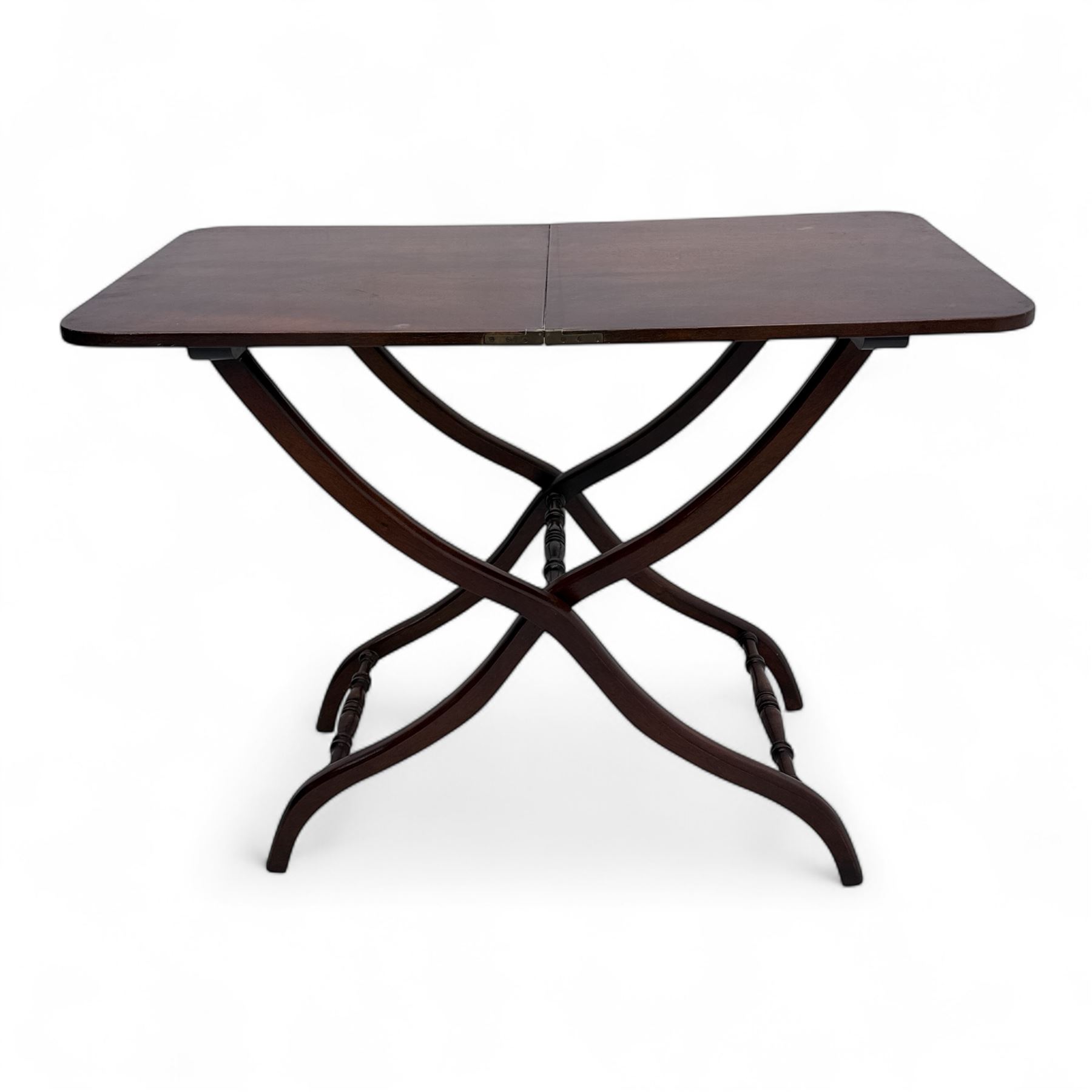 20th century mahogany folding coaching table, hinged rectangular  folding top, divided into two sections, supported on an X-frame with turned stretchers 
