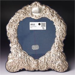 Silver heart shape photograph frame with embossed decoration on easel stand H29cm overall ...