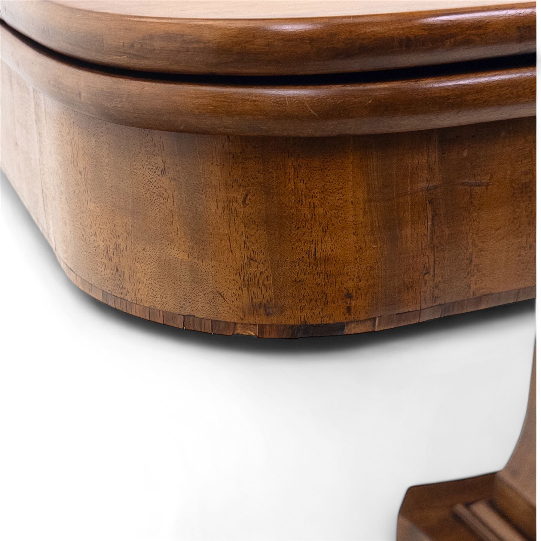 Regency mahogany fold-over table, hinged top with rounded corners opening to reveal a plain polished surface, supported on moulded pedestal base with reeded downswept legs, terminating in brass cups and castors (Extends to 90cm)