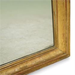 Louis XVI style gilt overmantel mirror, arched rectangular form with moulded frame, surmounted by a pediment carved with ribbon-tied grapevine and leaf decoration, enclosing a plain mirror plate, circa 1900