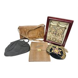 Continental petit point evening bag, with enamel and pearl details, in wooden display frame, together with a snake skin handbag and three other vintage bags