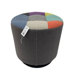 Circular revolving pouffe footstool, upholstered in grey with multi-colour patch seat