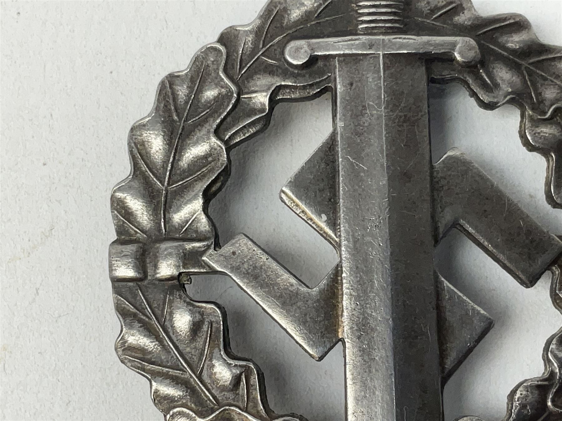 Two WW2 German Sports badges - SA sports badge marked verso 'W.Redo Eigentum D. Obersten SA. Fuhrung Saar Lautern'; and DRL sports badge marked verso 'Wernstein Jena D.R.G.M. 35269' (2)