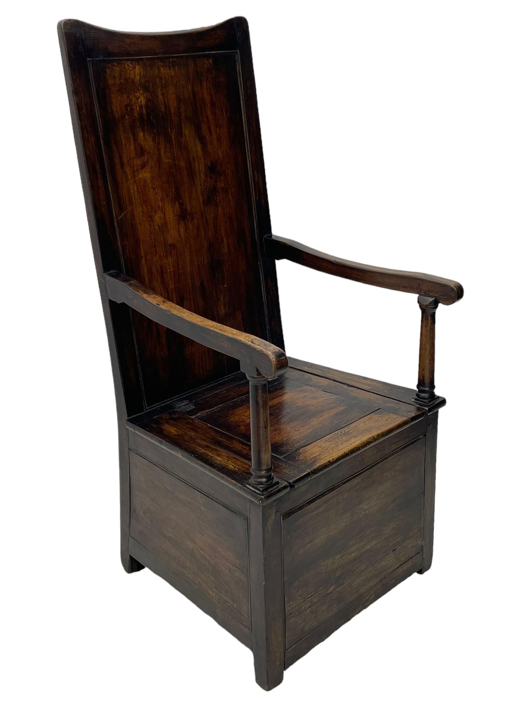 18th century elm box-seat lambing chair, dished cresting rail over panelled back, panelled hinged lid flanked by two turned arm supports