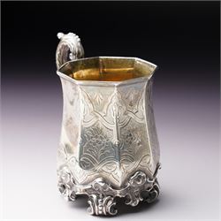 Victorian silver christening mug of panel sided design with gilded interior, engraved decoration and scroll handle and feet H10cm London 1848 Maker Charles Reily & George Storer