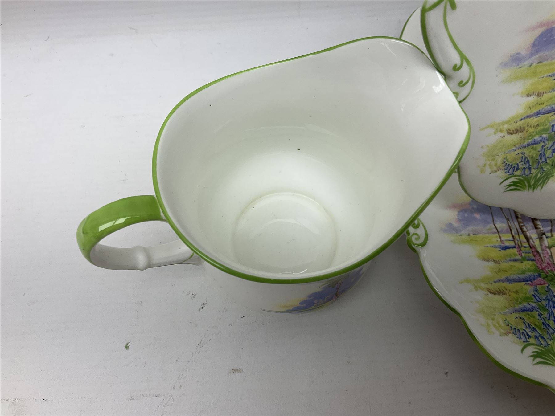 Aynsley Bluebell Time 'As Supplied to the Queen' tea service, comprising hot water jug, six teacups and saucers, milk jug, two cake plates and tow trinket dishes  