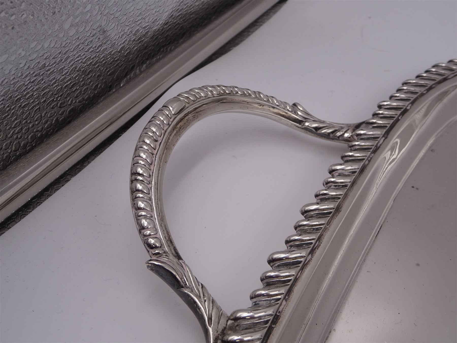 Edwardian silver twin handled tray, with oblique gadrooned rim and presentation engraving to the centre, hallmarked James Dixon & Sons Ltd, Sheffield 1907, not including handles W46cm