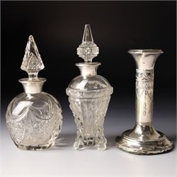 Silver upright photograph frame, aperture size 14cm x 9.5cm Birmingham 1919, pair of glass scent flasks with silver collars H16cm , two others, two dressing table jars with silver covers and a silver candlesticks