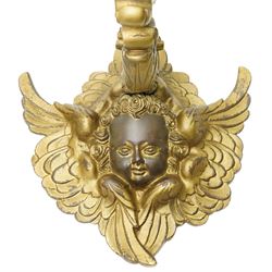 Pair of rococo style continental gilt bronze figural wall lights, modelled with winged putti figures, projection 37cm