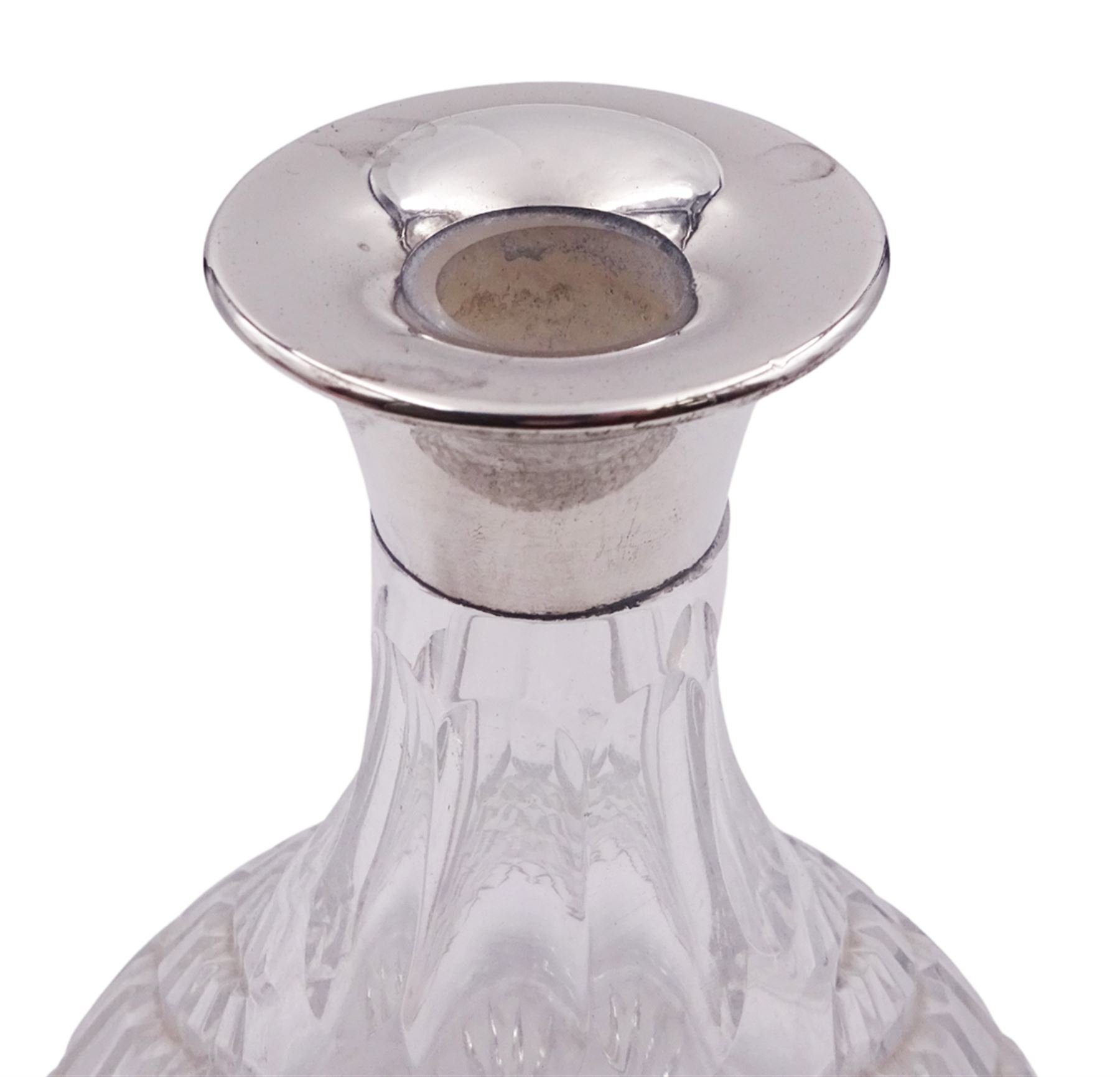 Modern silver mounted cut glass ships decanter, the silver collar hallmarked Charles S Green & Co Ltd, Birmingham 1976, H26.5cm, together with a modern silver mounted glass vase, of slightly tapering cylindrical form etched with ferns and fronds, the silver collar hallmarked London 2001, makers mark W W, H19cm, (2)