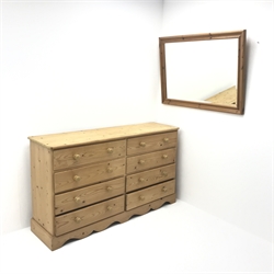 Pine chest, eight drawers, shaped plinth base (W152cm, H88cm, D41cm) and a pine framed mirror (W104cm, H74cm)