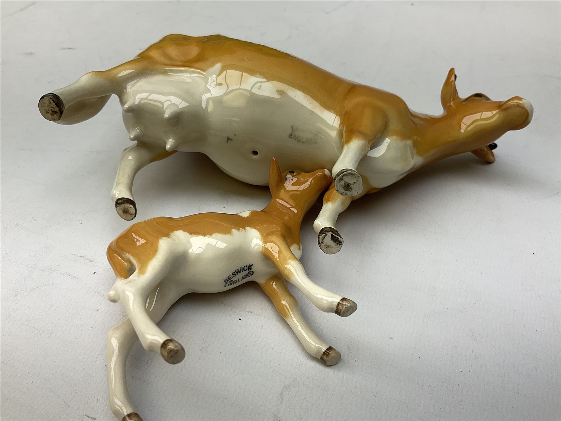 Beswick Guernsey cow family group, comprising bull 'Sabrina's Sir Richmond' no 1451, cow no 1248a and calf no 1249a, all with printed mark beneath and with original boxes 